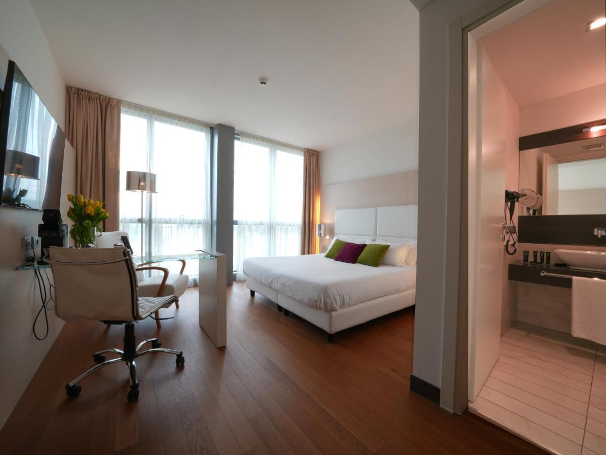 أبيتاليا تاور بلازا بيزا المظهر الخارجي الصورة A typical room at the hotel