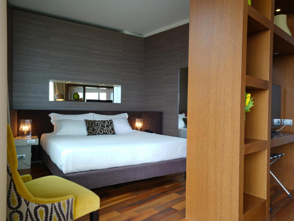 أبيتاليا تاور بلازا بيزا المظهر الخارجي الصورة A bedroom at the hotel